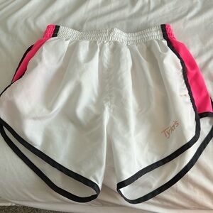 Tylers athletic shorts in with with black and pink details